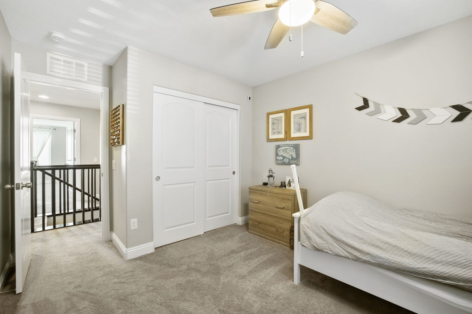 Third bedroom, closet and landing beyond.